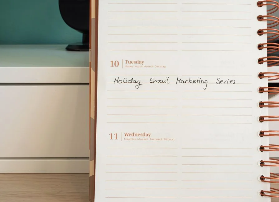 Close-up of handwritten Marketing Strategy text with an arrow on white background.